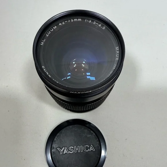 Yashica Zoom Lens 42- 75mm with case & Hakuba uv 55mm lens